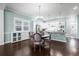 Cozy dining area adjacent to the updated kitchen, with built-in wine rack and storage at 11346 E 27Th Ave, Denver, CO 80238
