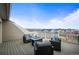 Outdoor patio with comfortable seating offers sweeping views of the surrounding neighborhood at 11346 E 27Th Ave, Denver, CO 80238