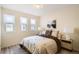 Comfortable bedroom featuring natural light from the windows and decorative lamps on nightstands at 2650 Hawthorne Pl, Boulder, CO 80304