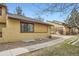 Exterior view of the home with a well-kept lawn, showcasing its pleasant curb appeal and architectural style at 2650 Hawthorne Pl, Boulder, CO 80304