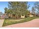 Charming home with mature trees, a well-manicured lawn, and partial fence at 2650 Hawthorne Pl, Boulder, CO 80304