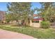 Charming home with mature trees, a well-manicured lawn, and partial fence at 2650 Hawthorne Pl, Boulder, CO 80304