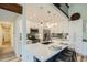 Modern kitchen with stainless steel appliances, a spacious island, and stylish pendant lighting at 2650 Hawthorne Pl, Boulder, CO 80304