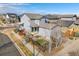 Aerial view of a well-maintained home featuring a backyard with a patio, fence, and small grass area at 1950 W 67Th Ave, Denver, CO 80221