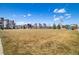 Expansive community park, with green grass, lush landscaping and walking path surrounded by modern homes at 1950 W 67Th Ave, Denver, CO 80221