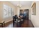 Dining room featuring dark wood floors, shuttered windows, and an antique china cabinet at 1950 W 67Th Ave, Denver, CO 80221