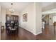 A formal dining room featuring hardwood floors, a dark wood china cabinet, and elegant lighting at 1950 W 67Th Ave, Denver, CO 80221