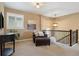Upstairs landing features a cozy seating area and a large window at 1950 W 67Th Ave, Denver, CO 80221