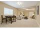 Cozy living room featuring a sofa and foosball table with neutral walls and carpet at 1950 W 67Th Ave, Denver, CO 80221