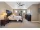 Relaxing main bedroom with neutral tones, ceiling fan, and well-lit space at 1950 W 67Th Ave, Denver, CO 80221