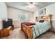 Cozy bedroom with a ceiling fan, large bed and lots of natural light at 11522 Pine Grove Ln, Parker, CO 80138