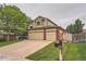 Charming home with a two-car garage, inviting curb appeal, and well-manicured lawn at 11522 Pine Grove Ln, Parker, CO 80138