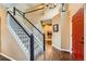 Bright foyer with hardwood floors, staircase, and view of the laundry room at 11522 Pine Grove Ln, Parker, CO 80138