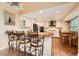 Modern kitchen with a large island with barstool seating and a breakfast nook at 11522 Pine Grove Ln, Parker, CO 80138