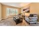 Inviting living room features large windows, neutral carpet, and comfortable seating at 11522 Pine Grove Ln, Parker, CO 80138