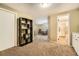 Cozy living room with neutral carpet, shelving, and natural light at 11522 Pine Grove Ln, Parker, CO 80138