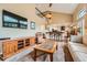 Spacious living room with vaulted ceilings, fireplace, and open to the kitchen at 11522 Pine Grove Ln, Parker, CO 80138