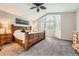 Comfortable main bedroom featuring a ceiling fan, shuttered windows and a large bed at 11522 Pine Grove Ln, Parker, CO 80138