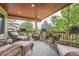 Inviting outdoor patio featuring comfortable wicker furniture and beautiful garden views at 11522 Pine Grove Ln, Parker, CO 80138