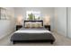 A large, naturally lit main bedroom with contemporary decor and plush carpeting at 4024 Upham St, Wheat Ridge, CO 80033