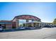 Modern retail building with a striking facade and prominent signage, offering a contemporary business environment at 4024 Upham St, Wheat Ridge, CO 80033