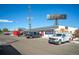 Commercial property featuring ample parking and prominent signage in a bustling marketplace location at 4024 Upham St, Wheat Ridge, CO 80033