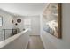 Bright upstairs hallway featuring wood floors, art and decorative accents at 4024 Upham St, Wheat Ridge, CO 80033