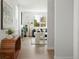 Stylish living room seamlessly connects to the entryway, featuring a large window and modern furnishings at 4024 Upham St, Wheat Ridge, CO 80033