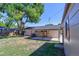 Backyard with patio cover, shed, and exterior of home showcasing outdoor living space at 7391 Dale Ct, Westminster, CO 80030