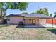 View of backyard showcasing covered patio, shed, and the home's exterior at 7391 Dale Ct, Westminster, CO 80030