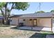 Exterior backyard view featuring a covered patio area perfect for outdoor enjoyment at 7391 Dale Ct, Westminster, CO 80030