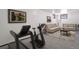 Spacious finished basement with a comfortable sofa and various exercise equipment at 7391 Dale Ct, Westminster, CO 80030