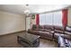 Comfortable living room with brown leather furniture, wood flooring, and modern decor at 7391 Dale Ct, Westminster, CO 80030