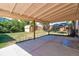 Outdoor patio featuring spacious concrete and an outdoor fireplace at 7391 Dale Ct, Westminster, CO 80030
