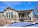 Backyard patio with grill and heater, offering outdoor entertaining space at 7766 Fraser River Cir, Littleton, CO 80125