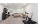 Finished basement recreation area with media and exercise at 7766 Fraser River Cir, Littleton, CO 80125