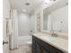 Basement bathroom with shower/tub, vanity, and mirror at 7766 Fraser River Cir, Littleton, CO 80125