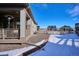 House exterior with covered patio and backyard view at 7766 Fraser River Cir, Littleton, CO 80125