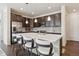 Modern kitchen with large island, stainless steel appliances, and white countertops at 7766 Fraser River Cir, Littleton, CO 80125