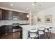 Modern kitchen with stainless steel appliances and white countertops at 7766 Fraser River Cir, Littleton, CO 80125