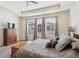 Main bedroom with plush carpet and lots of natural light at 7766 Fraser River Cir, Littleton, CO 80125