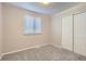 Bright bedroom with large window and closet provides ample space for relaxation and storage at 11617 W 71St Dr, Arvada, CO 80004