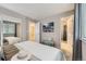Neutral bedroom with modern decor, featuring an ensuite bath and ample closet space at 11617 W 71St Dr, Arvada, CO 80004