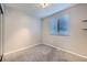 Inviting bedroom features a closet, large window, and plush carpeting for comfort at 11617 W 71St Dr, Arvada, CO 80004