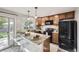 The kitchen has wood cabinets, granite countertops, and stainless steel appliances at 11617 W 71St Dr, Arvada, CO 80004
