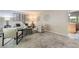 Bright living room featuring plush carpet and a modern decor with ample natural light at 11617 W 71St Dr, Arvada, CO 80004
