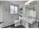 Bathroom featuring a single vanity, white tile, and a black tiled floor at 29304 Thimbleberry Ln, Evergreen, CO 80439