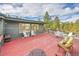 An expansive back deck gives plenty of space for outdoor seating and relaxing at 29304 Thimbleberry Ln, Evergreen, CO 80439