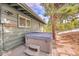 An outdoor hot tub sitting on the back patio is easily accessible from the house via a short set of stairs at 29304 Thimbleberry Ln, Evergreen, CO 80439