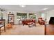 Living room features a leather couch, hard wood furniture, and a bookshelf at 29304 Thimbleberry Ln, Evergreen, CO 80439